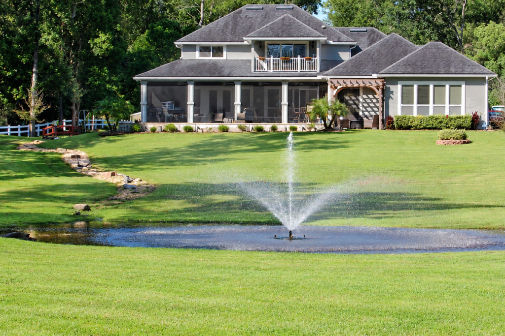 Lawn and Ornamental Care Services performed on North Florida lawn surrounding a pond and fountain